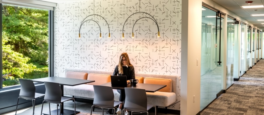 Woman working at a booth table in Flex at Chesterbrook